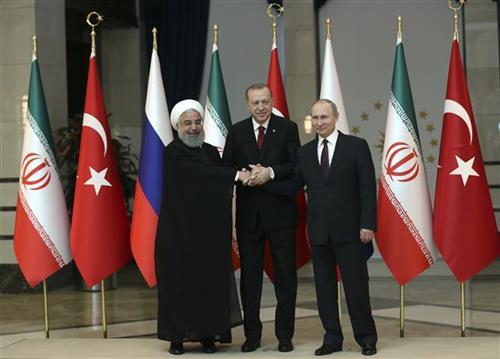 Putin, Rohani i Erdogan Foto: Tolga Bozoglu/Pool Photo via AP